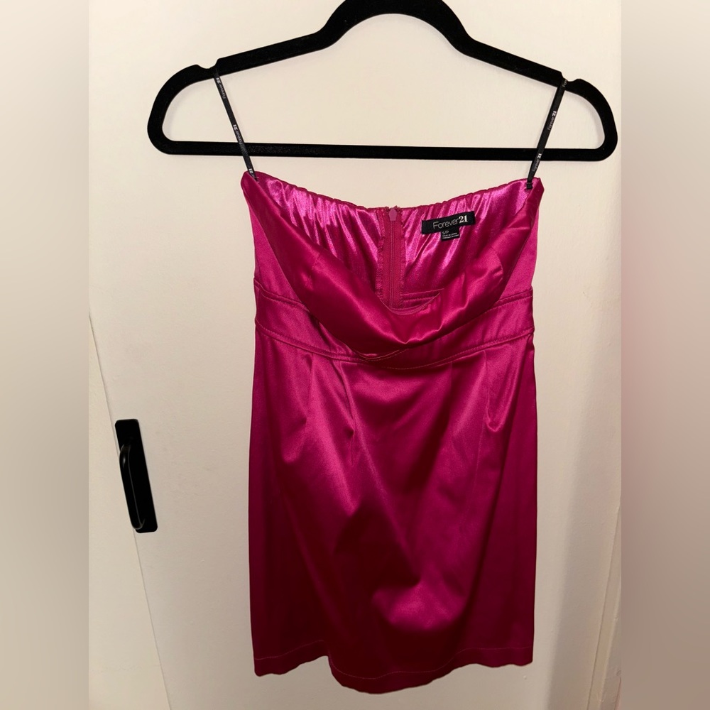 A satin, pink strapless sweetheart neckline with concealed zipper in back.